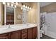 Bathroom features double sink vanity with a shower and tub combination at 16401 S 29Th Ave, Phoenix, AZ 85045
