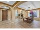 Open concept dining area with ample seating, hardwood floors, and abundant natural light at 16401 S 29Th Ave, Phoenix, AZ 85045