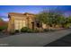 Charming home showcasing a tile roof, stone accents, manicured landscaping and an attached garage at 16401 S 29Th Ave, Phoenix, AZ 85045