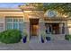 Inviting entrance with stone accents and stylish front porch seating at 16401 S 29Th Ave, Phoenix, AZ 85045