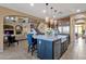 Bright kitchen with an island, stainless steel appliances, and seamless access to the living room at 16401 S 29Th Ave, Phoenix, AZ 85045