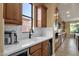 This bright kitchen features stainless steel appliances, a white countertop and eye-catching backsplash at 16401 S 29Th Ave, Phoenix, AZ 85045