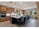 Spacious kitchen with an island, stainless steel appliances, and a view to the outdoor living area at 16401 S 29Th Ave, Phoenix, AZ 85045