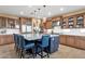 Kitchen with stainless steel appliances, granite countertops, and an island with bar seating at 16401 S 29Th Ave, Phoenix, AZ 85045