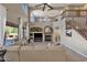 Well-lit living room with tall ceilings, fireplace, and large windows providing lots of natural light at 16401 S 29Th Ave, Phoenix, AZ 85045