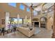 Bright living room with a fireplace, tall ceilings, lots of natural light, and view of the pool at 16401 S 29Th Ave, Phoenix, AZ 85045