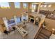 Spacious living room with high ceilings, large windows overlooking the pool, and a cozy fireplace at 16401 S 29Th Ave, Phoenix, AZ 85045