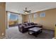 Spacious living room with a sliding glass door leading to a balcony with beautiful scenic views at 16401 S 29Th Ave, Phoenix, AZ 85045