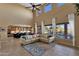 Bright living room with tall ceilings and multiple windows offering a view of the backyard at 16401 S 29Th Ave, Phoenix, AZ 85045