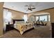 Main bedroom features a sitting area and carpeted floors and an ensuite bath with neutral colors at 16401 S 29Th Ave, Phoenix, AZ 85045