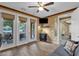 Bright office features custom built-ins, wood floors, and access to outdoor patio through French doors at 16401 S 29Th Ave, Phoenix, AZ 85045