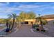Outdoor kitchen and patio with a grill, built-in cabinets, pizza oven, desert landscaping and a seating area at 16401 S 29Th Ave, Phoenix, AZ 85045