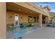 Covered patio with outdoor seating, ceiling lights and access to lush backyard at 16401 S 29Th Ave, Phoenix, AZ 85045