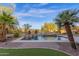 Backyard pool and spa surrounded by desert landscaping and brick trim at 16401 S 29Th Ave, Phoenix, AZ 85045