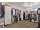 Large walk-in closet with custom shelving and ample storage space for clothes, shoes, and accessories at 16401 S 29Th Ave, Phoenix, AZ 85045