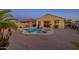 Backyard with pool, spa, seating, and desert landscaping at 1654 E Jardin Pl, Casa Grande, AZ 85122