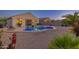 Backyard with a pool, spa, seating, and desert landscaping at 1654 E Jardin Pl, Casa Grande, AZ 85122