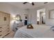 Bright bedroom featuring a dresser, decorative mirror, and entry to closet and bathroom at 1654 E Jardin Pl, Casa Grande, AZ 85122