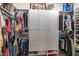 Walk-in closet with custom shelving and storage solutions for organized wardrobe management at 1654 E Jardin Pl, Casa Grande, AZ 85122