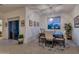 The dining area showcases a modern chandelier, scenic views, and a decorative area rug at 1654 E Jardin Pl, Casa Grande, AZ 85122