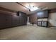 Spacious garage with ample storage cabinets and epoxy flooring at 1654 E Jardin Pl, Casa Grande, AZ 85122