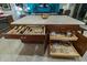 Kitchen island with built-in storage solutions offering both open and closed compartments for kitchenware and essentials at 1654 E Jardin Pl, Casa Grande, AZ 85122