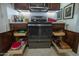 Modern kitchen with updated appliances, open cabinet storage, and a sleek design for convenient cooking at 1654 E Jardin Pl, Casa Grande, AZ 85122