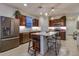 Modern kitchen with stainless steel appliances, a central island with seating, and ample cabinet space at 1654 E Jardin Pl, Casa Grande, AZ 85122