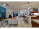 Open-concept living area featuring stylish furniture, a bright accent wall, and sliding doors to outdoor patio at 1654 E Jardin Pl, Casa Grande, AZ 85122