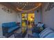 Relaxing covered patio with cozy seating and string lights at 1654 E Jardin Pl, Casa Grande, AZ 85122