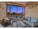 Comfortable patio with pool view, seating, and string lights at 1654 E Jardin Pl, Casa Grande, AZ 85122