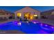 Backyard view showcasing the lit pool, spa and patio, perfect for entertaining at 1654 E Jardin Pl, Casa Grande, AZ 85122