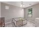 Neutral bedroom with a window providing natural light and wood-look floors at 16954 W Mohave St, Goodyear, AZ 85338
