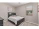 Bedroom featuring carpeted floors and a dark bedframe and furniture at 16954 W Mohave St, Goodyear, AZ 85338