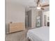 Bedroom featuring neutral colored walls, carpeted floors, a ceiling fan, and a wooden dresser at 16954 W Mohave St, Goodyear, AZ 85338
