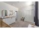 Bedroom featuring carpeted floors, a dresser and lots of natural light at 16954 W Mohave St, Goodyear, AZ 85338