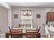 Dining room with rustic light fixture and seating for six at 16954 W Mohave St, Goodyear, AZ 85338