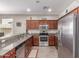 Well-equipped kitchen featuring stainless steel appliances and granite countertops at 16954 W Mohave St, Goodyear, AZ 85338
