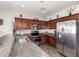 Well-equipped kitchen featuring stainless steel appliances and granite countertops at 16954 W Mohave St, Goodyear, AZ 85338