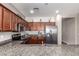 Well-equipped kitchen featuring stainless steel appliances and granite countertops at 16954 W Mohave St, Goodyear, AZ 85338