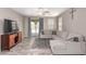 Comfortable living room featuring a neutral color palette and wood-look floors at 16954 W Mohave St, Goodyear, AZ 85338