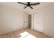 Bedroom with a ceiling fan, view of a closet, and en-suite bathroom at 1720 W Behrend Dr, Phoenix, AZ 85027