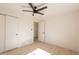 Bedroom with a ceiling fan, closet, and en-suite bathroom at 1720 W Behrend Dr, Phoenix, AZ 85027