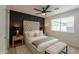 Chic bedroom with a luxurious upholstered bed, modern wall paneling, and soft lighting for a serene retreat at 1720 W Behrend Dr, Phoenix, AZ 85027