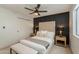 This bedroom boasts a neutral color palette, ceiling fan, and tufted headboard at 1720 W Behrend Dr, Phoenix, AZ 85027