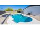 Inviting pool area with desert landscaping and grassy area at 1720 W Behrend Dr, Phoenix, AZ 85027