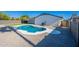Backyard pool area featuring desert landscaping and covered patio at 1720 W Behrend Dr, Phoenix, AZ 85027