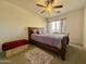 Cozy bedroom with a bed, ceiling fan, area rug, and lots of light from the window at 1758 E San Xavier Dr, Casa Grande, AZ 85122