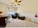 Bright bedroom featuring chair and ottoman, ceiling fan, and a window with lots of light at 1758 E San Xavier Dr, Casa Grande, AZ 85122