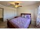 Bedroom featuring a bed, ceiling fan, window, and closet with sliding doors at 1758 E San Xavier Dr, Casa Grande, AZ 85122